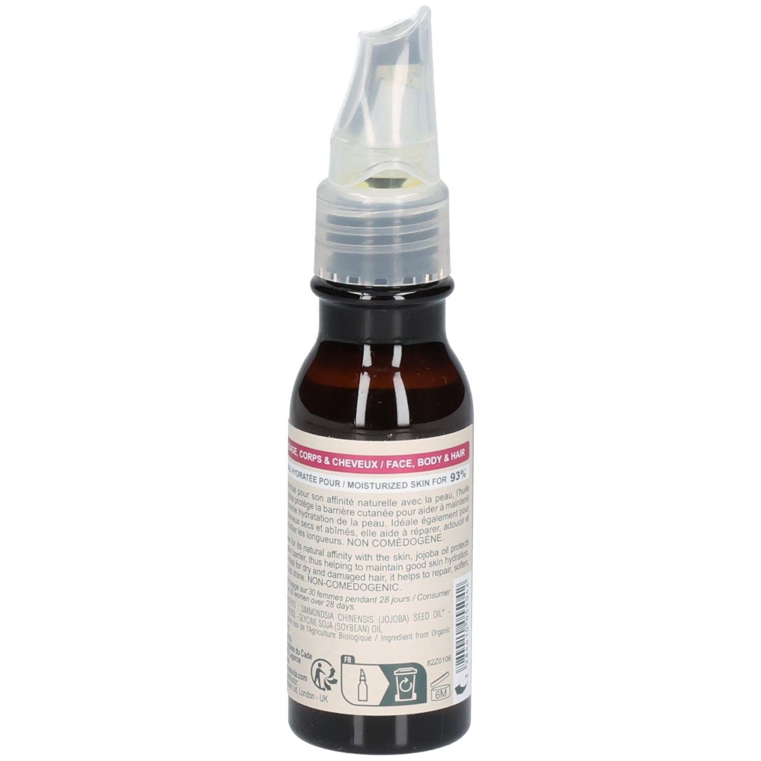 Flacon en verre brun avec applicateur. Étiquette avec informations produit. Certification BIO. Pour corps, visage et cheveux.