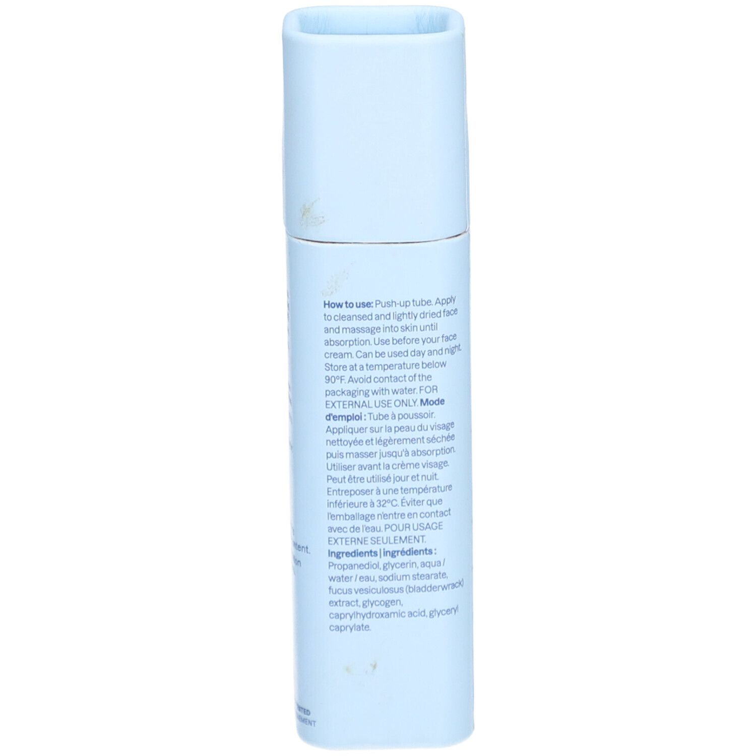 Lichtblauwe serumstick. Opschrift: Gebruiksaanwijzing, ingrediënten. Voor uitwendig gebruik. Ingrediënten: Water, Glycerine, Bladderwrack Extract.