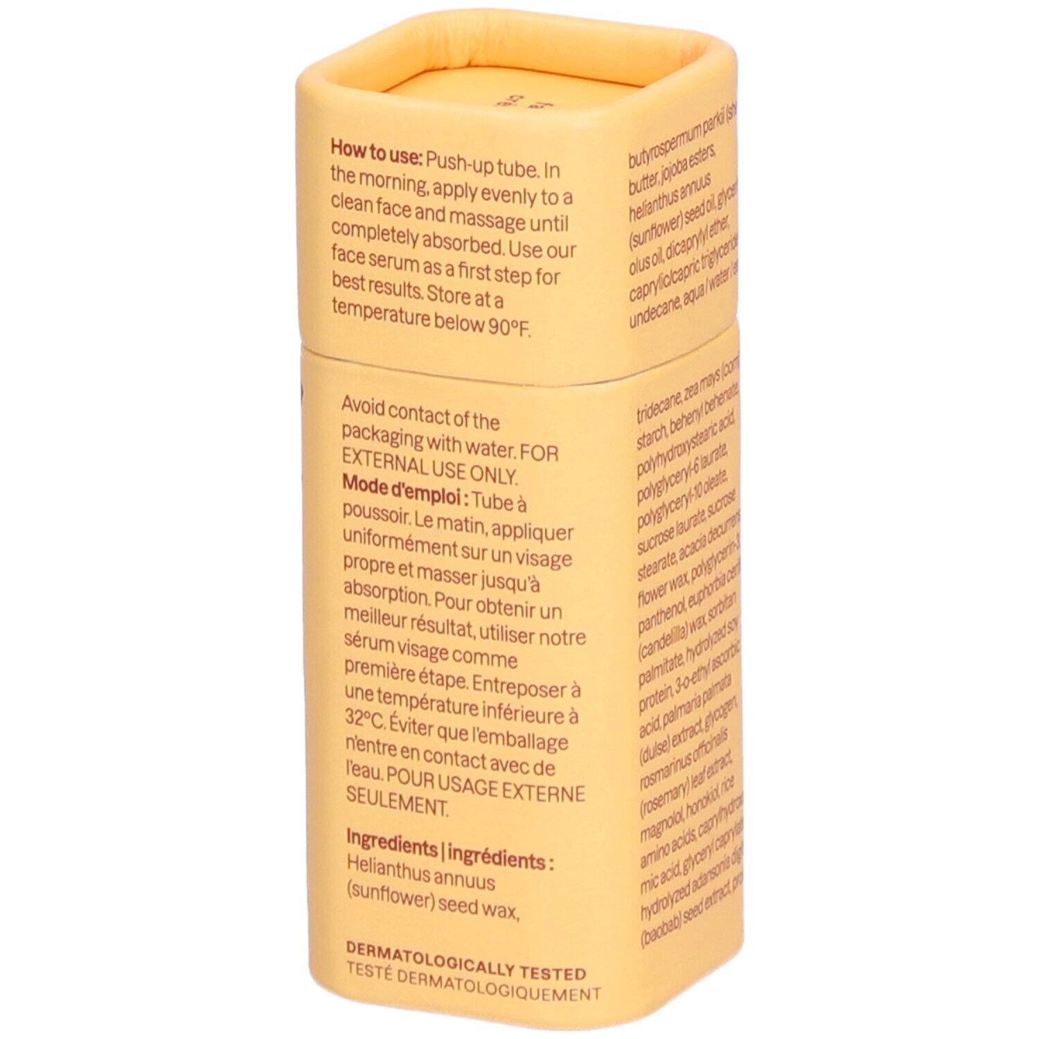 Emballage cylindrique jaune. Texte: How to use, Mode d'emploi, Ingredients, Testé dermatologiquement. Texte en anglais et français.