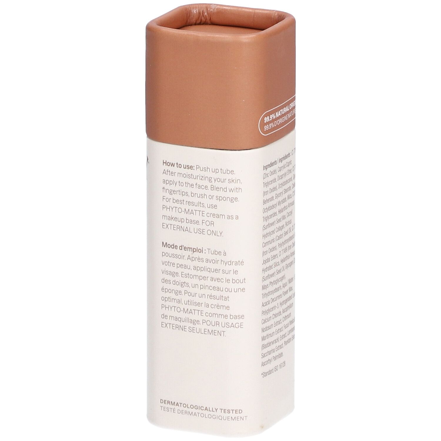 Fond de teint en bâton. Emballage blanc et marron. Instructions d'utilisation. Inscription: Testé dermatologiquement.
