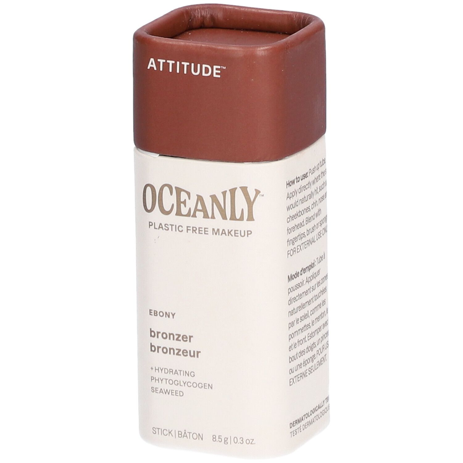 Cilindrische bronzer-stick. Bruin boven, wit onder met tekst. Merk: ATTITUDE, product: OCEANLY, Ebony.