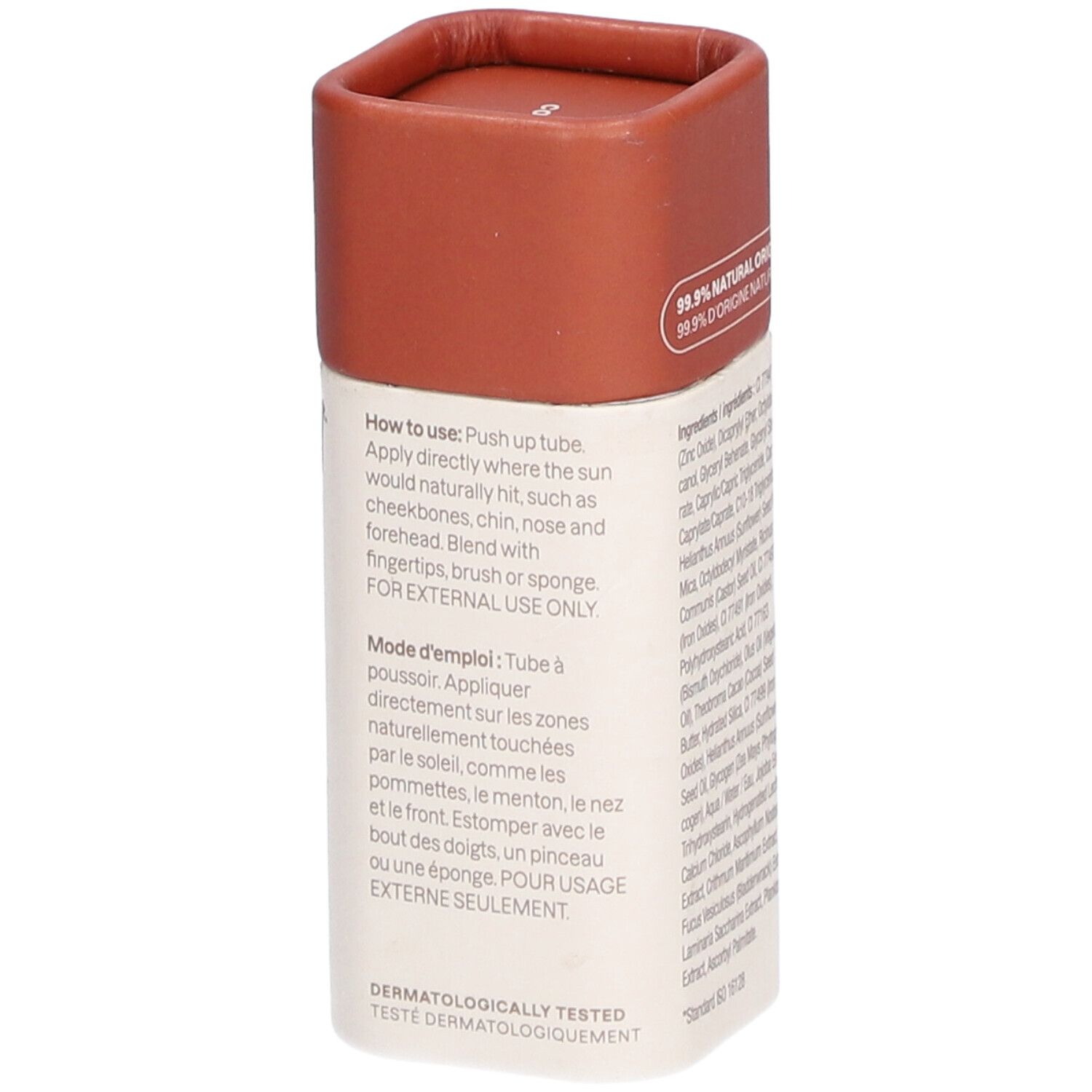 Stick bronzer avec couvercle marron. Inscription : 99,9% d'origine naturelle. Mode d'emploi. Testé dermatologiquement.