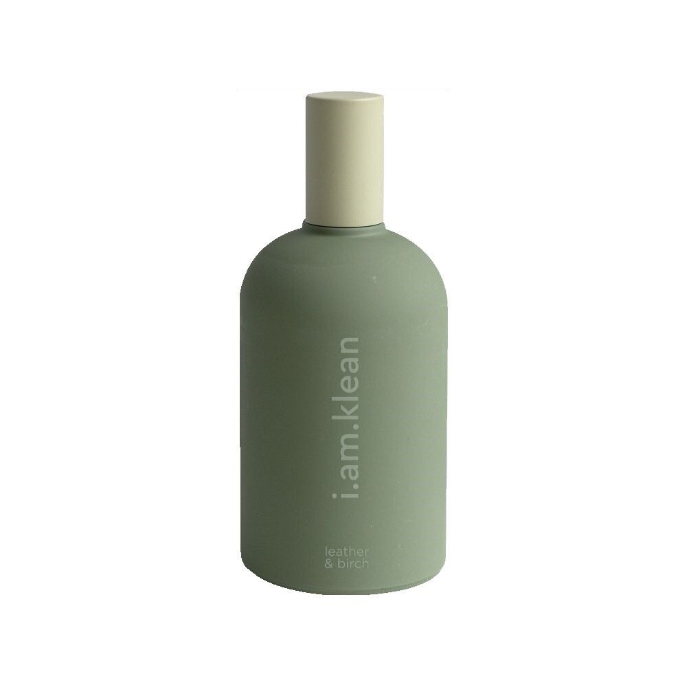 Grüne Flasche mit beigem Verschluss. Aufschrift: i.am.klean, leather & birch.