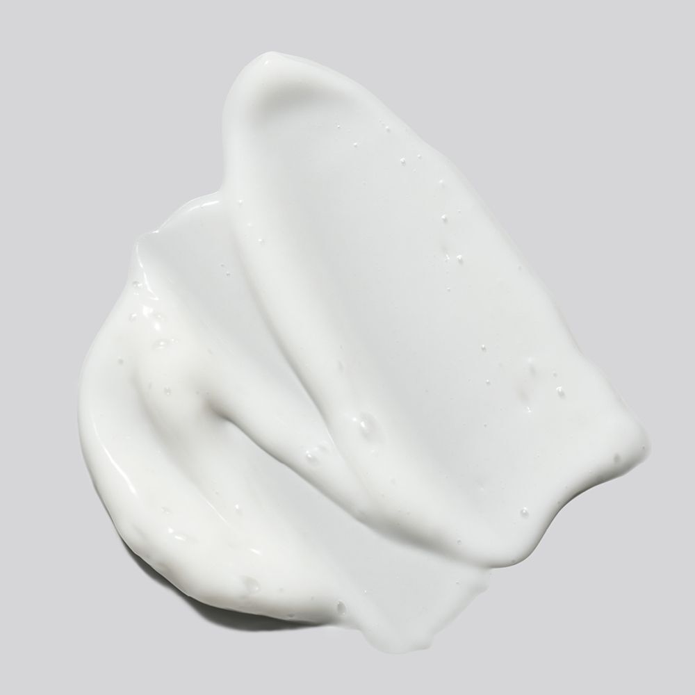 Nahaufnahme von weißer Creme. Zwei cremige Streifen auf grauem Hintergrund.