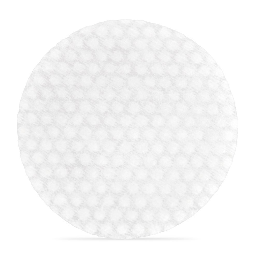 Pad rond blanc avec surface texturée. Pour les soins de la peau.