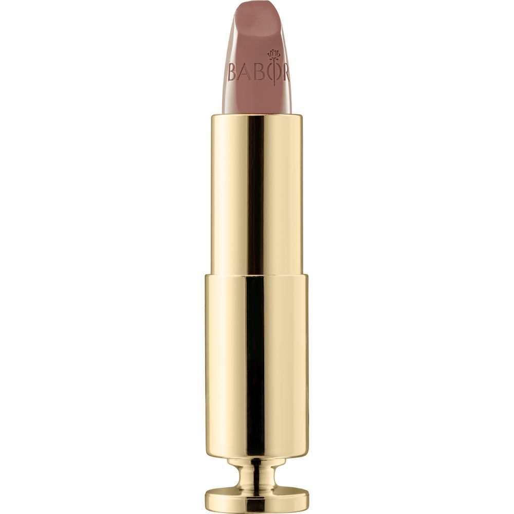 Rouge à lèvres doré avec embout beige. La marque Babor est visible.