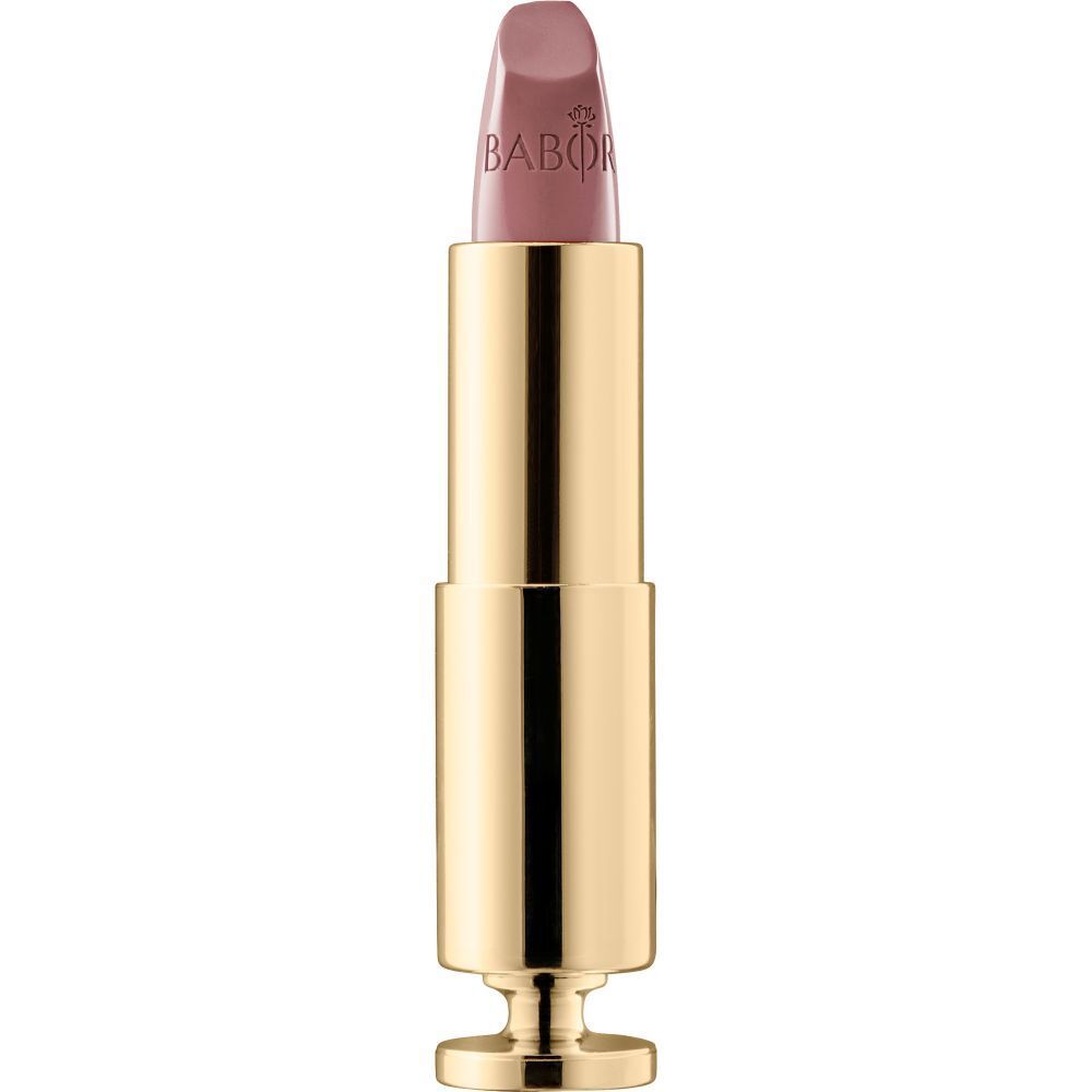 Goldfarbener Lippenstift mit hellrosa Spitze. Marke Babor.