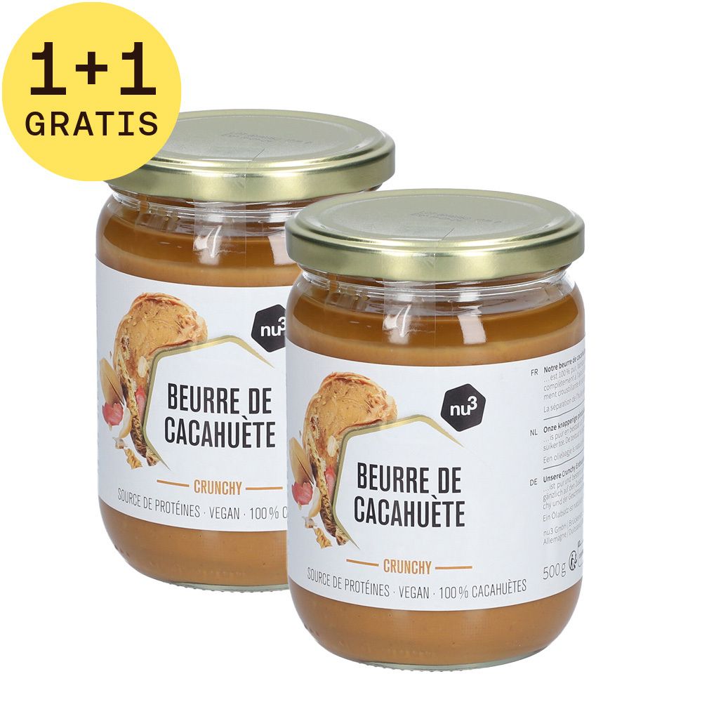 Twee potten pindakaas met gouden deksels. Opschrift: 1+1 GRATIS. Etiket met productnaam en logo.