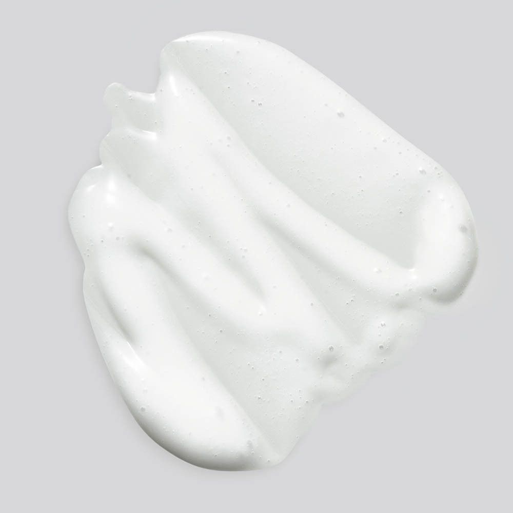 Weißes Produkt auf grauem Hintergrund. Textur.