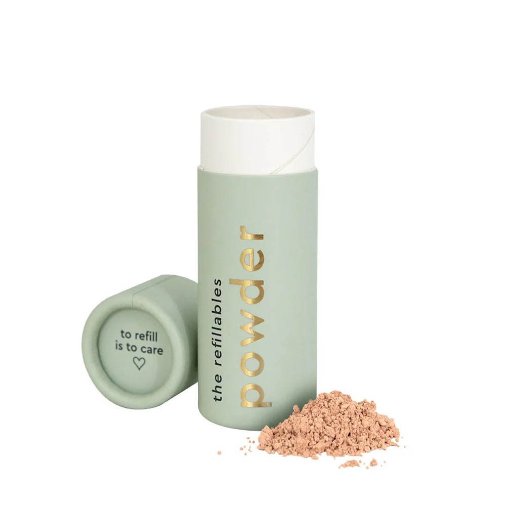 Recharge cylindrique vert clair avec poudre en vrac. Inscription "to refill is to care".