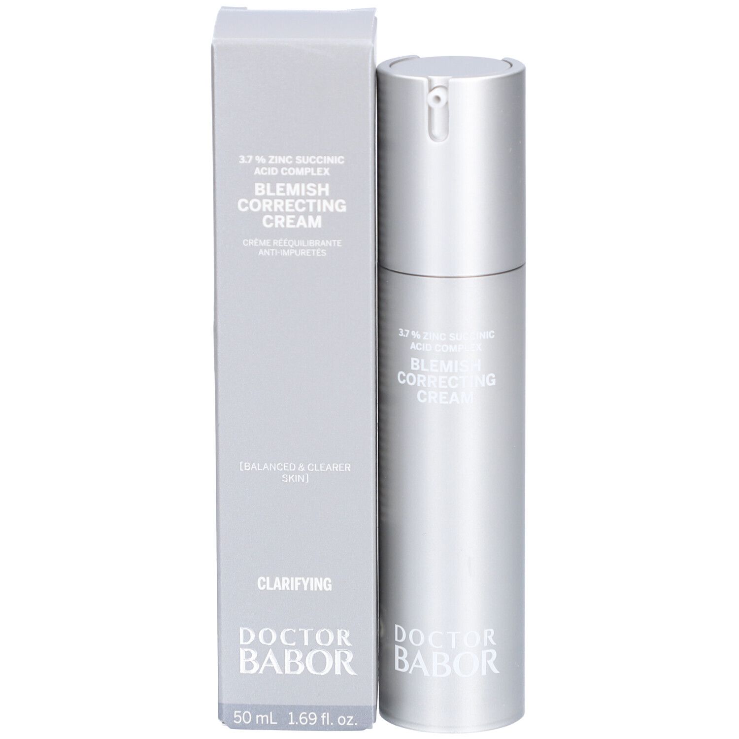 Produkt und Verpackung. Silberne Flasche und graue Schachtel. Text: Blemish Correcting Cream, Doctor Babor.