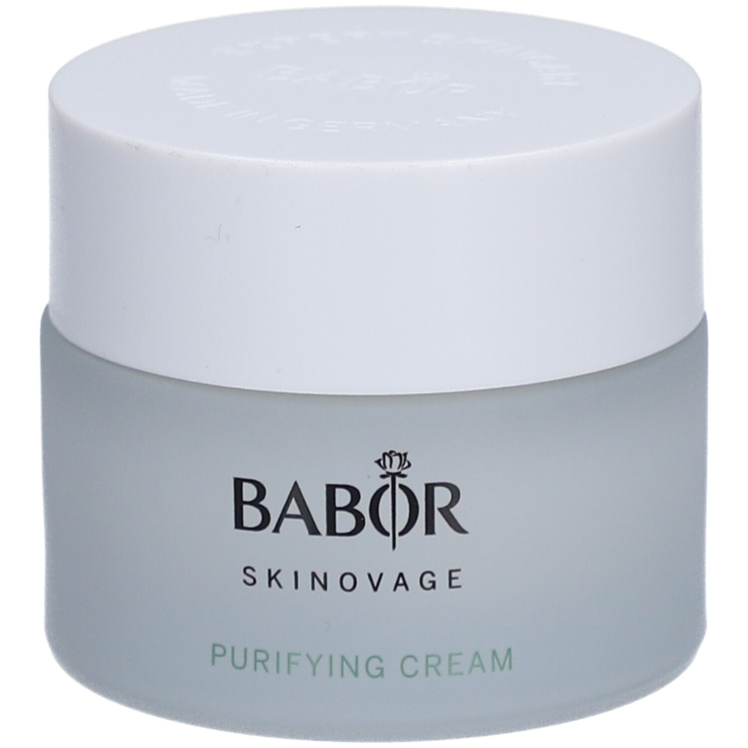 Creme-Tiegel mit weißem Deckel. Auf dem Tiegel steht BABOR SKINAVAGE PURIFYING CREAM.