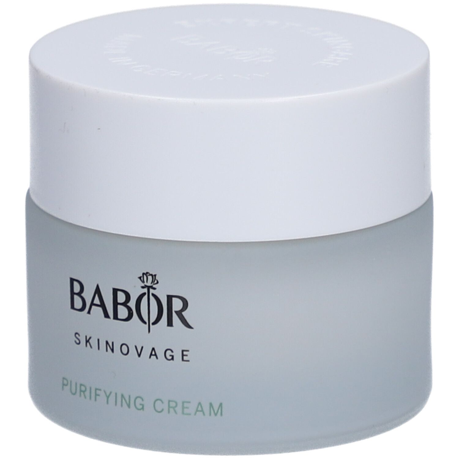 Cremetiegel mit weißem Deckel. Auf dem Tiegel steht BABOR SKINAVAGE PURIFYING CREAM.