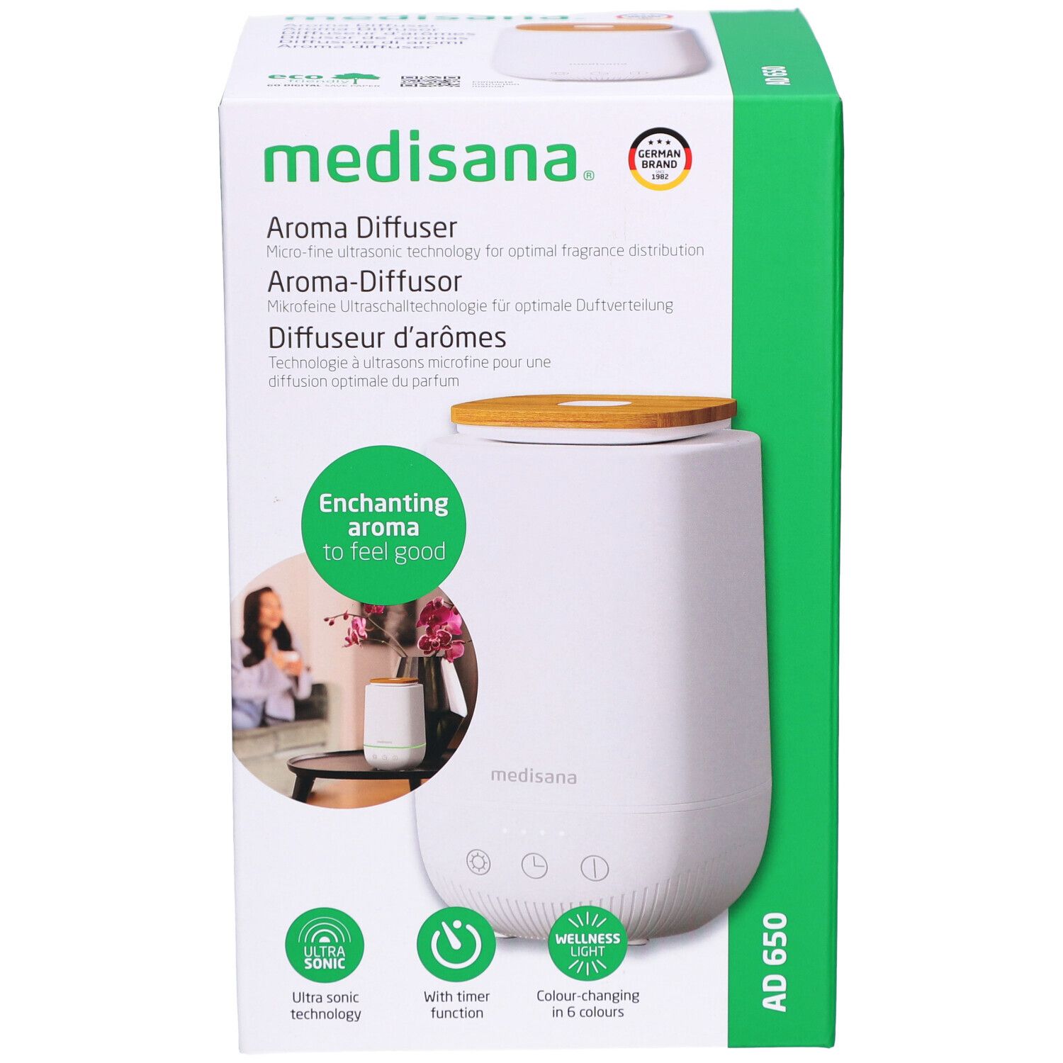 Aroma-Diffusor in Verpackung. Weiß, Holzdeckel, grüne Verpackung. Marke: medisana. Produktname: AD 650.