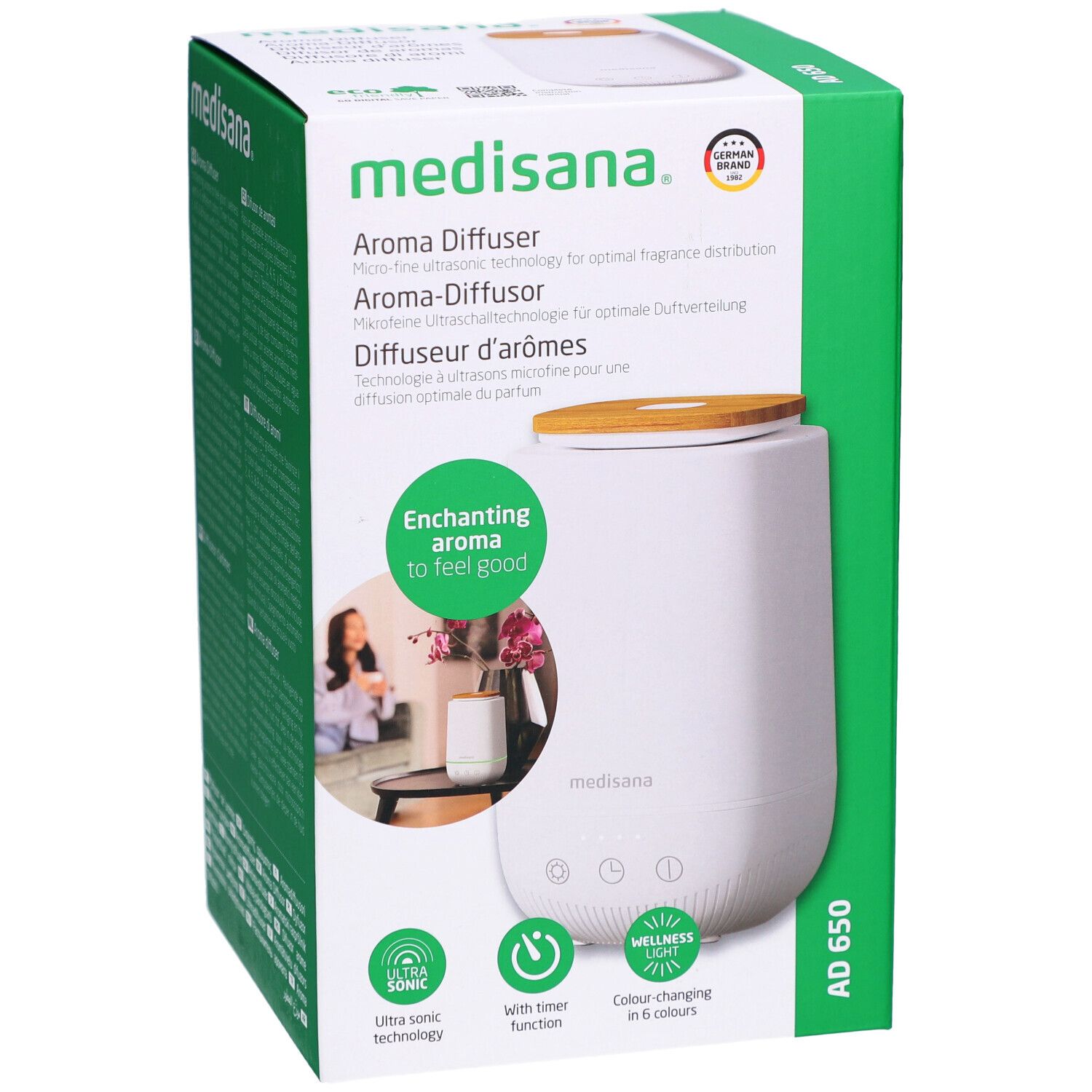 Aroma-Diffusor in Verpackung. Weiß, Holzdeckel, grüne Verpackung. Marke: medisana. Produktname: AD 650.