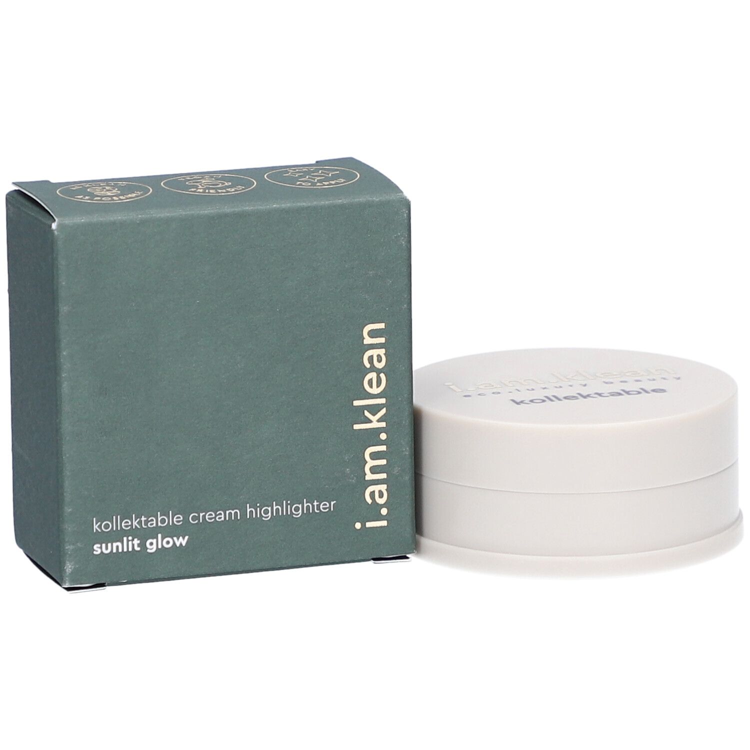 Grüne Schachtel und cremefarbener Behälter. Auf der Schachtel steht i.am.klean, kollektable cream highlighter sunlit glow. Der Behälter hat einen Deckel mit Schriftzug.