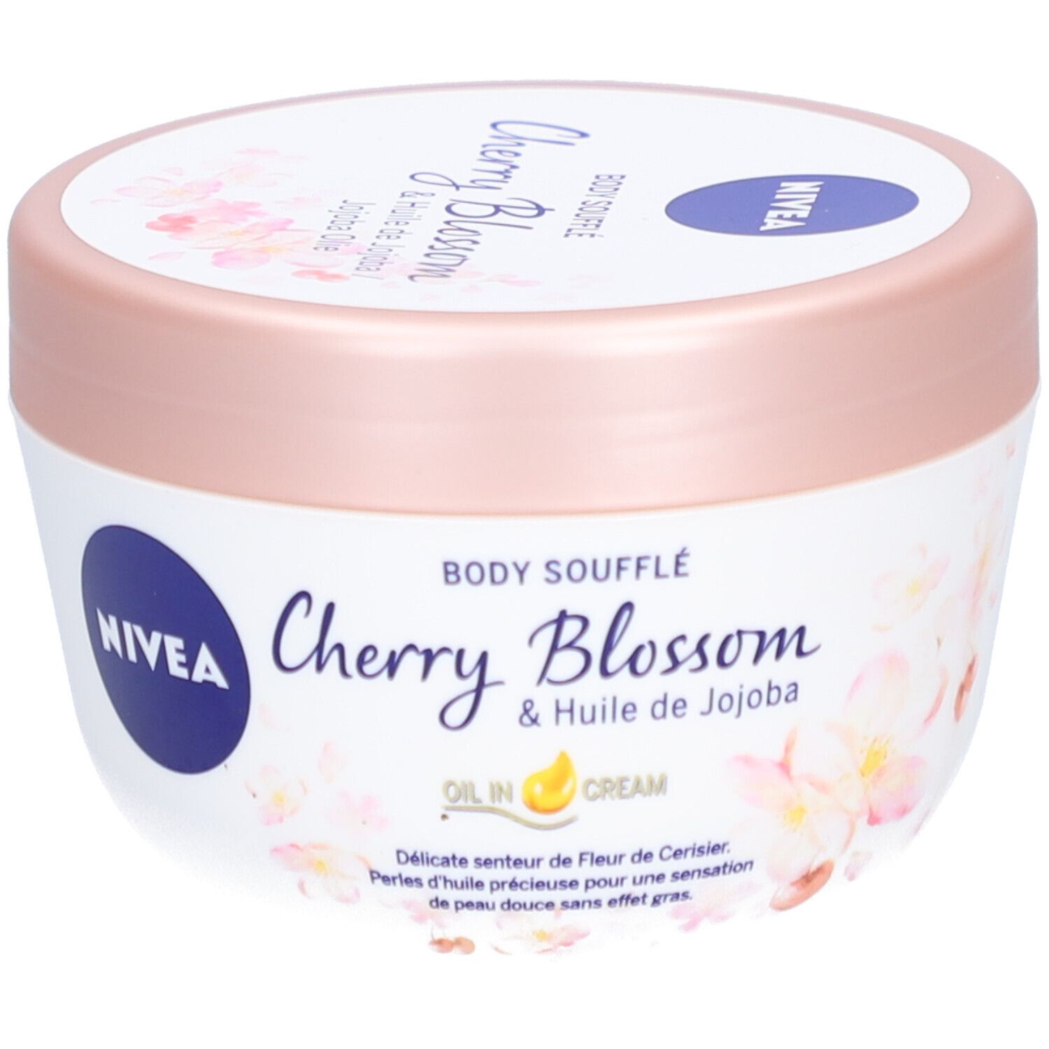 Witte pot met roze deksel. Opschrift: NIVEA, Body Soufflé Cherry Blossom & Jojoba Olie. Bloemenpatroon.