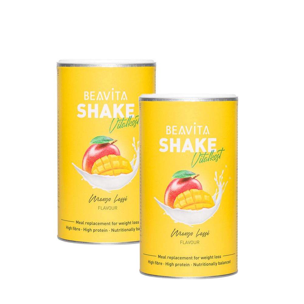 Deux boîtes jaunes BEAVITA Shake Vitality Mango Lassi. Illustration de mangue et pomme. Texte: Meal replacement for weight loss.