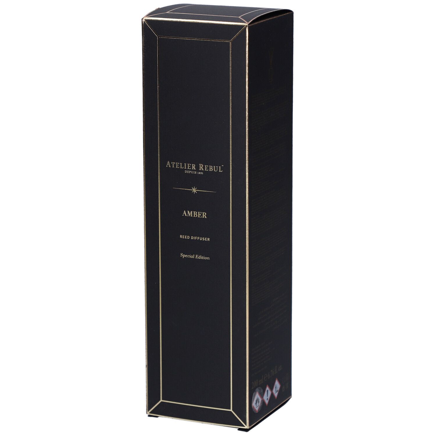 Schwarze Box für Reed Diffuser mit goldener Schrift 'Atelier Rebul Amber Special Edition'.