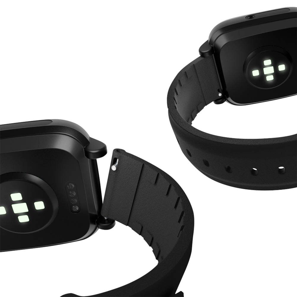 Deux montres connectées noires avec bracelets noirs. Arrière avec capteurs.
