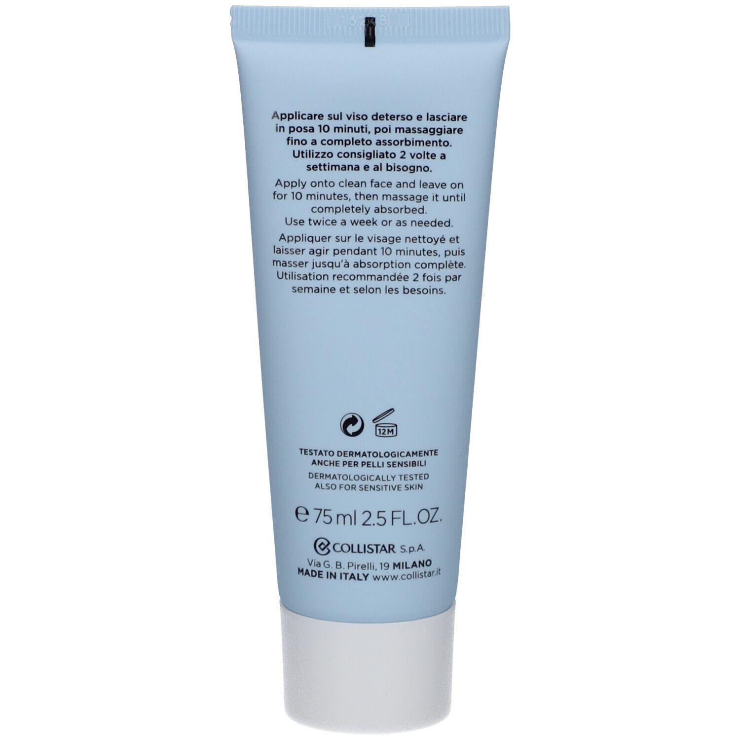 Achterkant van de lichtblauwe tube. Meertalige tekst: gebruik, ingrediënten, fabrikantinfo, dermatologisch getest.