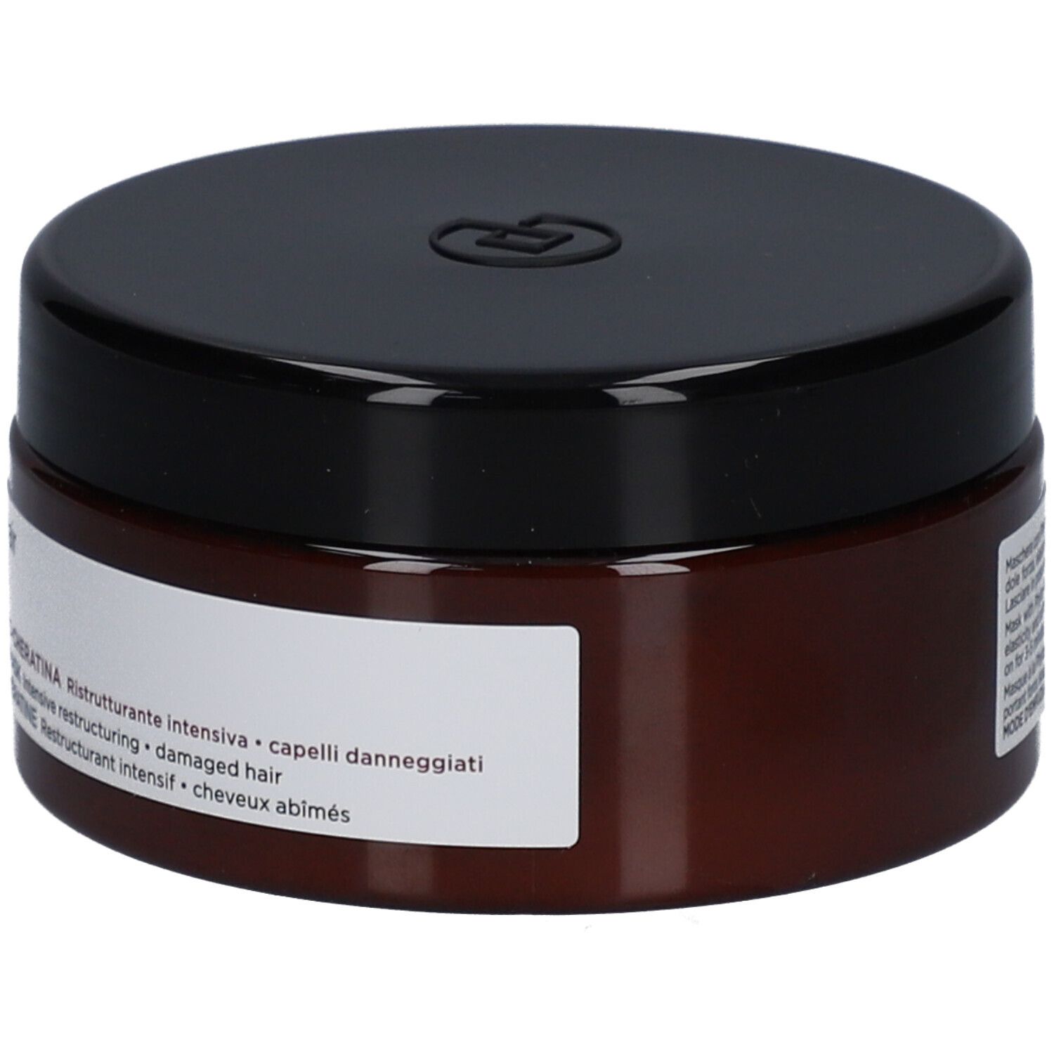 Braune Dose mit schwarzem Deckel. Aufschrift: Maschera Phyto-Cheratina, für geschädigtes Haar.
