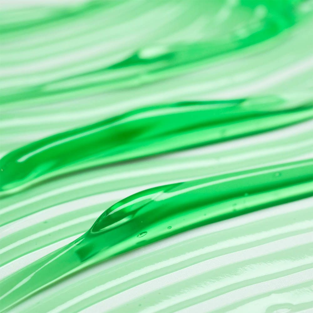 Gros plan sur des bandes de gel vert sur fond blanc.