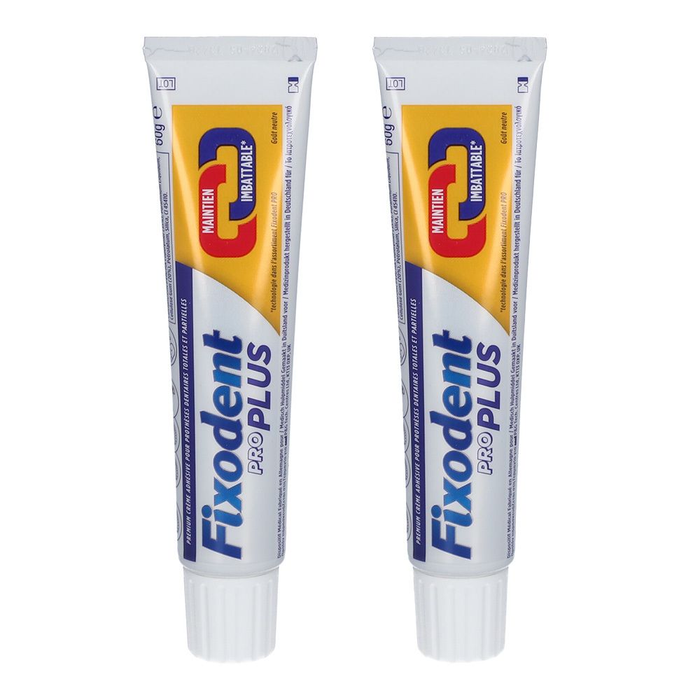 Deux tubes de Fixodent Pro Plus. Tubes blancs avec texte bleu et jaune. Inscription: Fixodent Pro Plus, Maintien Imbattable.