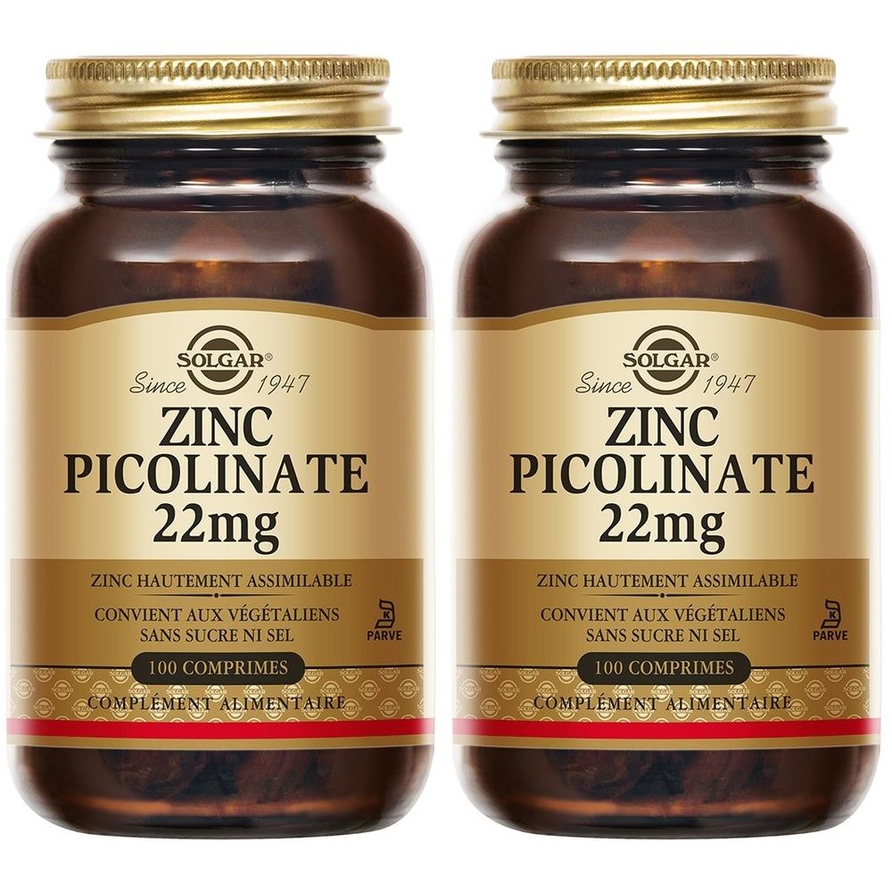 Twee flessen Solgar Zink Picolinaat 22mg. Bruine glazen flessen met gouden doppen en etiketten. Opschrift: Zink Picolinaat, 22mg, 100 tabletten.