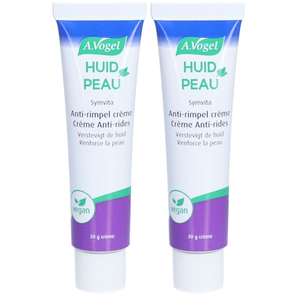 Twee tubes A.Vogel Symvita anti-rimpelcrème. Wit-blauwe verpakking met paarse accenten. Vegan label.