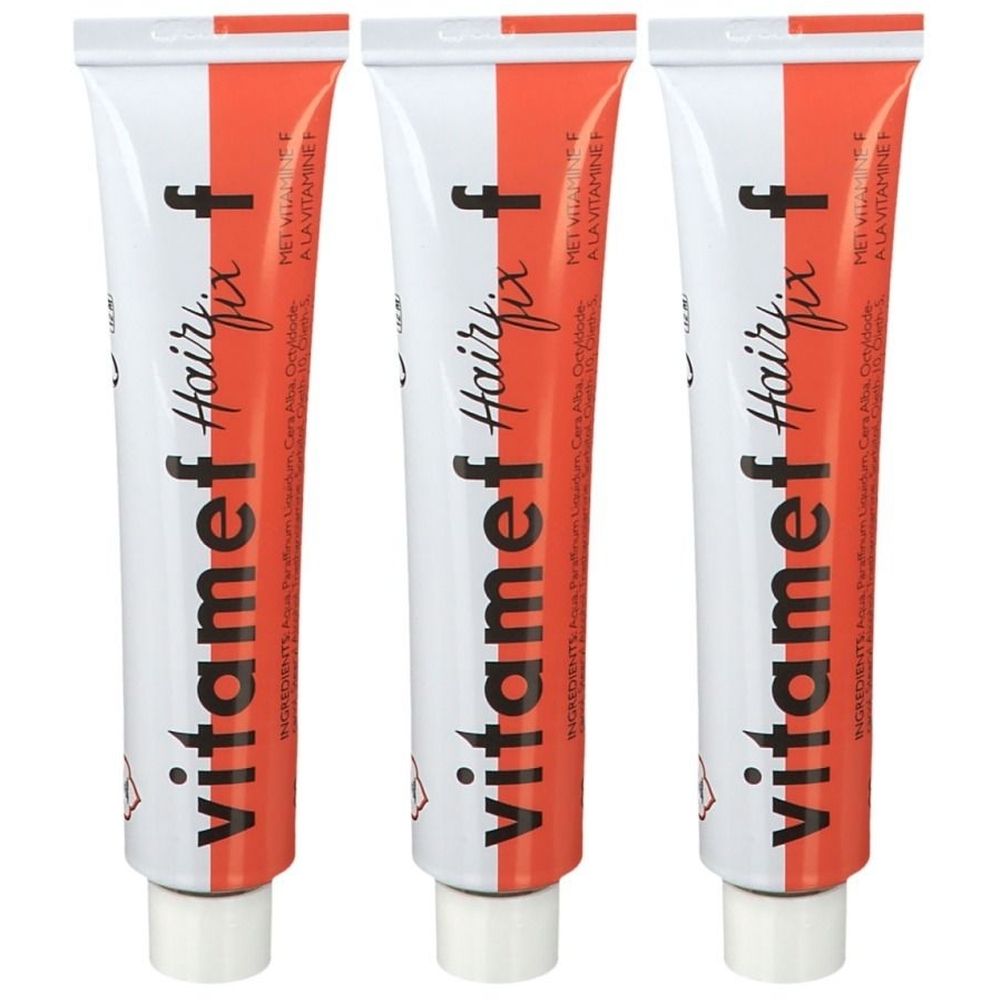 Drie tubes Vitamef Hairfix. Witte tubes met rode streep en tekst. Bevat ingrediënten en een gevaarsymbool.