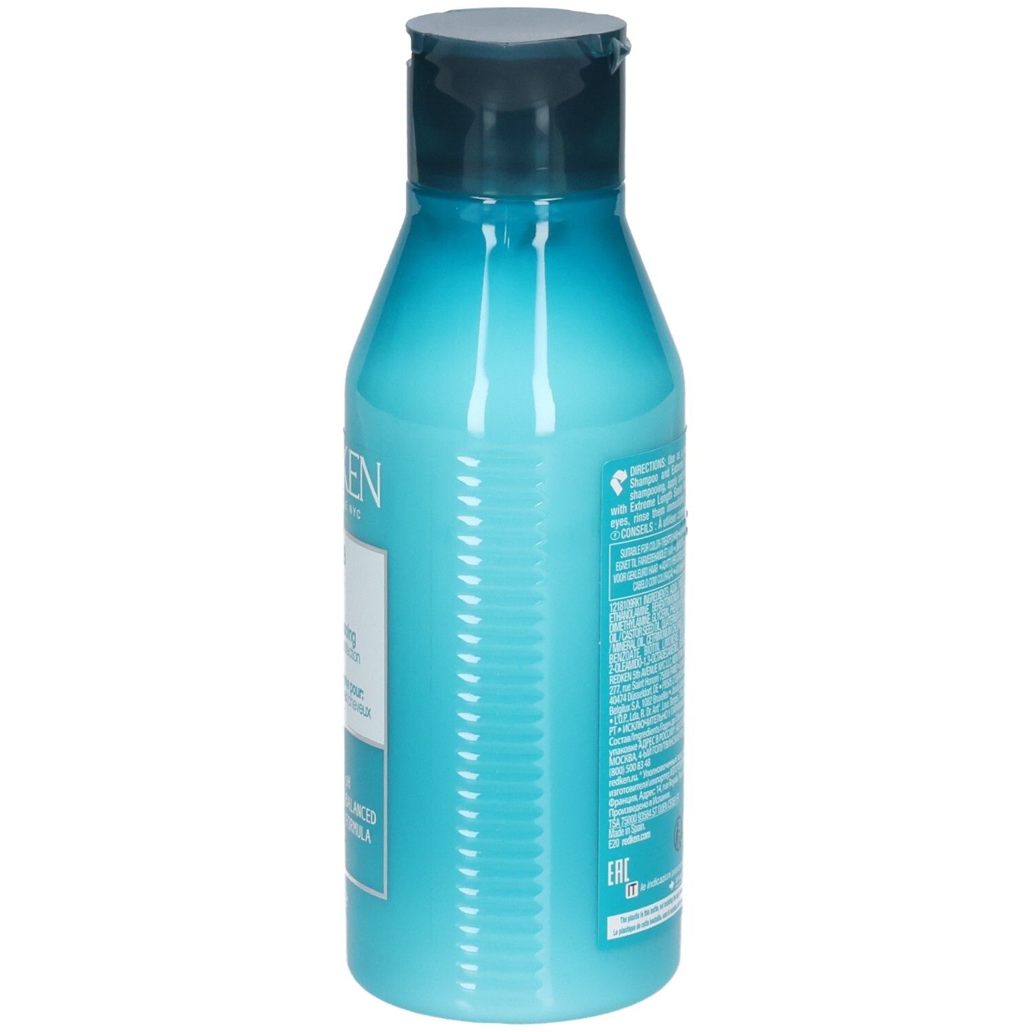 Türkisfarbene Flasche mit blauem Klappdeckel. Enthält eine hellblaue Flüssigkeit. Etikett mit Text.