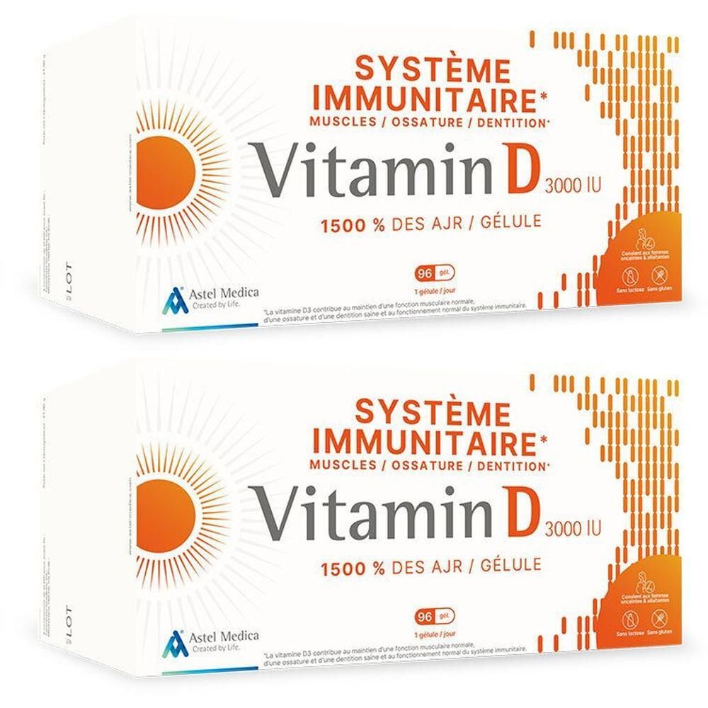 Deux boîtes de Vitamine D Astel Medica. Inscription: Vitamine D 3000 UI, 1500% des AJR. Contient 90 gélules. Logo soleil orange.