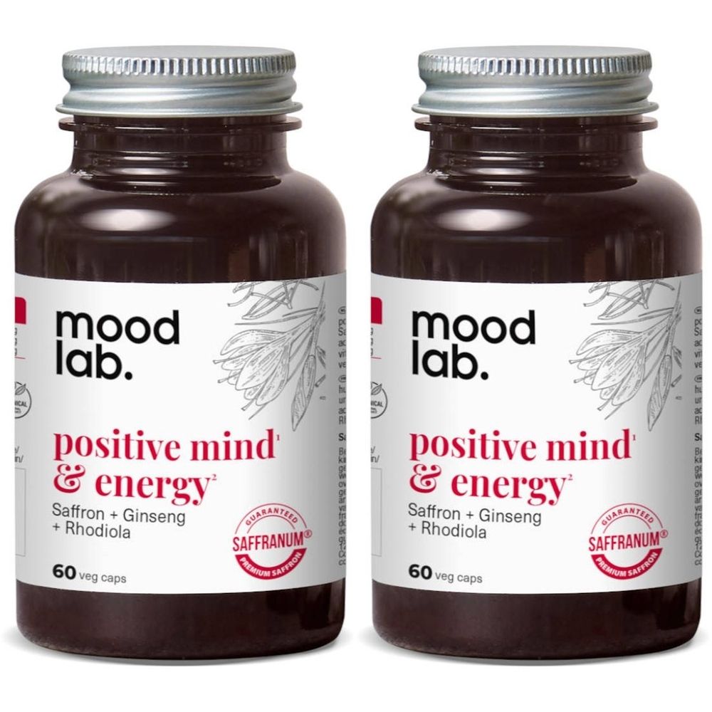 Twee bruine glazen flessen met zilveren doppen. Labels tonen "mood lab. positive mind & energy". Bevat 60 capsules.