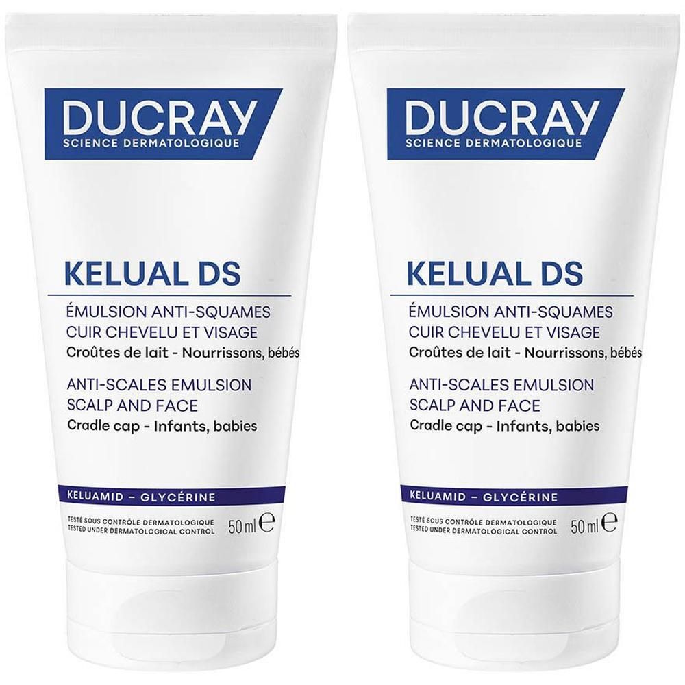 Twee tubes DUCRAY KELUAL Emulsion. Wit, met blauwe en zwarte tekst. Opschrift: Emulsie, gezicht en hoofdhuid, verzacht irritatie.