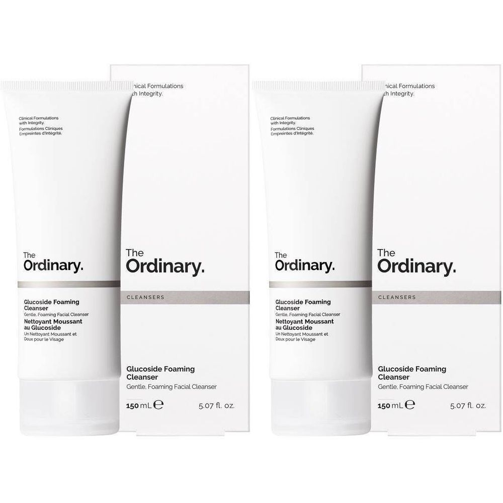 Zwei weiße Tuben und Kartons. Aufschrift: The Ordinary, Glucoside Foaming Cleanser. 150ml.