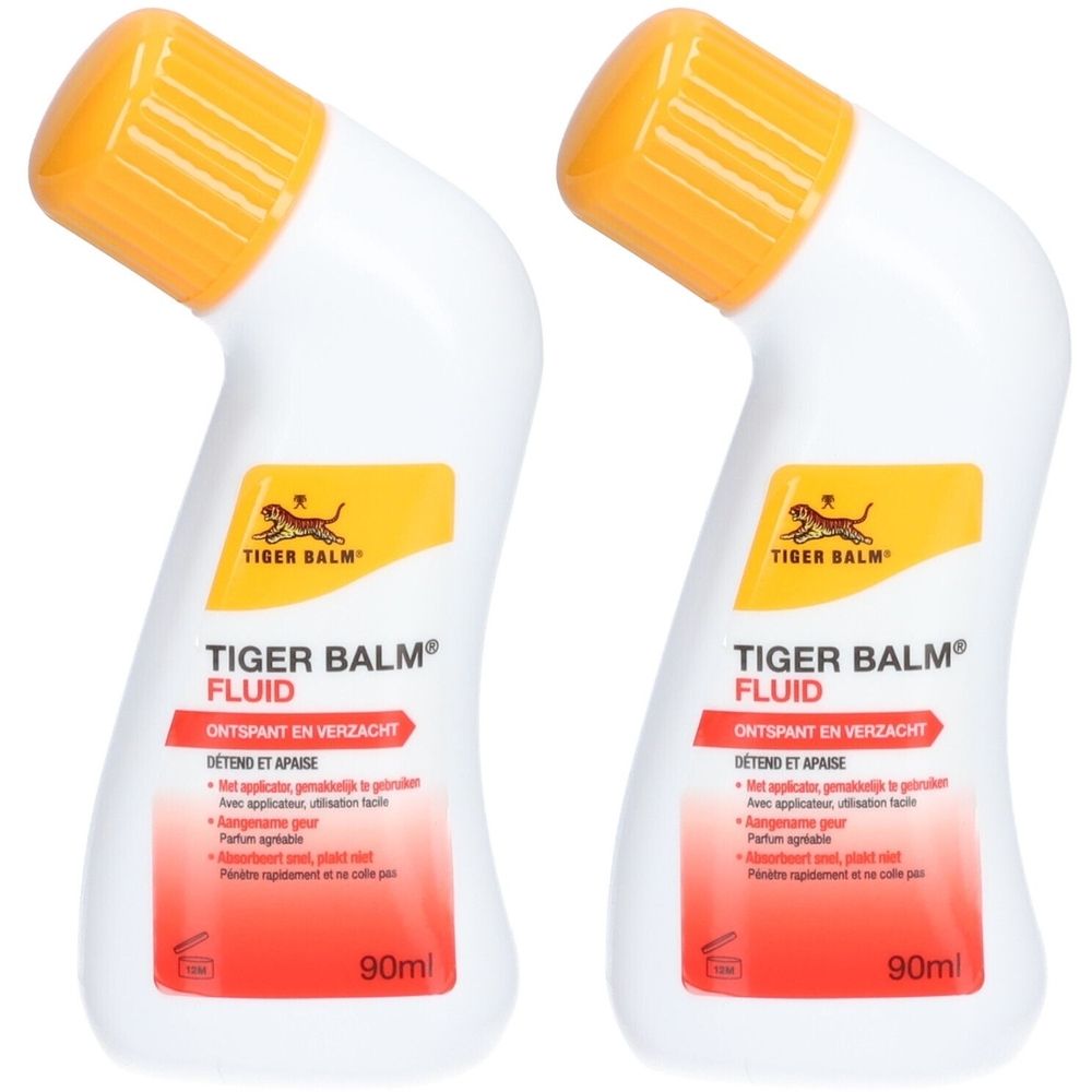 Twee flessen Tiger Balm® Fluid. Witte flessen met gele doppen. Rode en gele opdruk. 90ml.