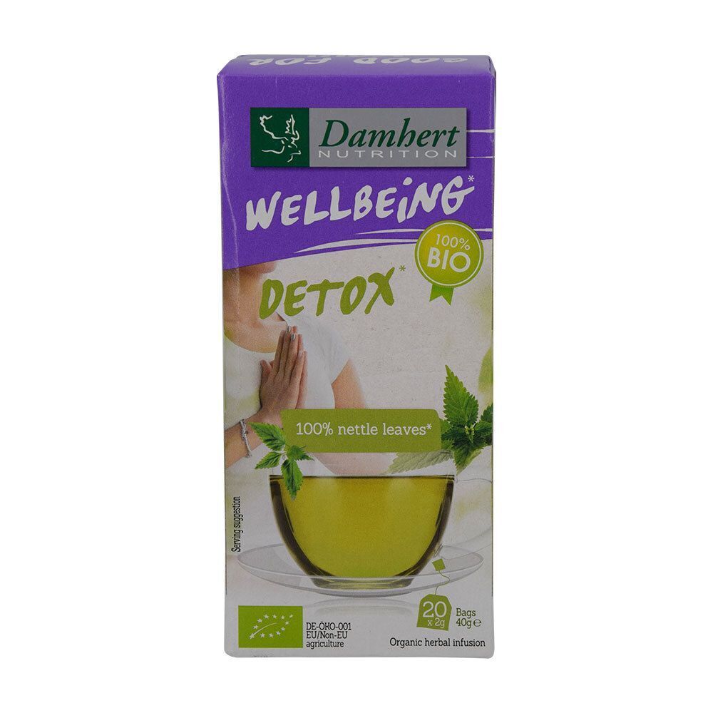 Damhert Wellbeing Detox Tee-Verpackung. Zeigt eine Tasse Tee mit Brennnesselblättern und dem Bio-Siegel.