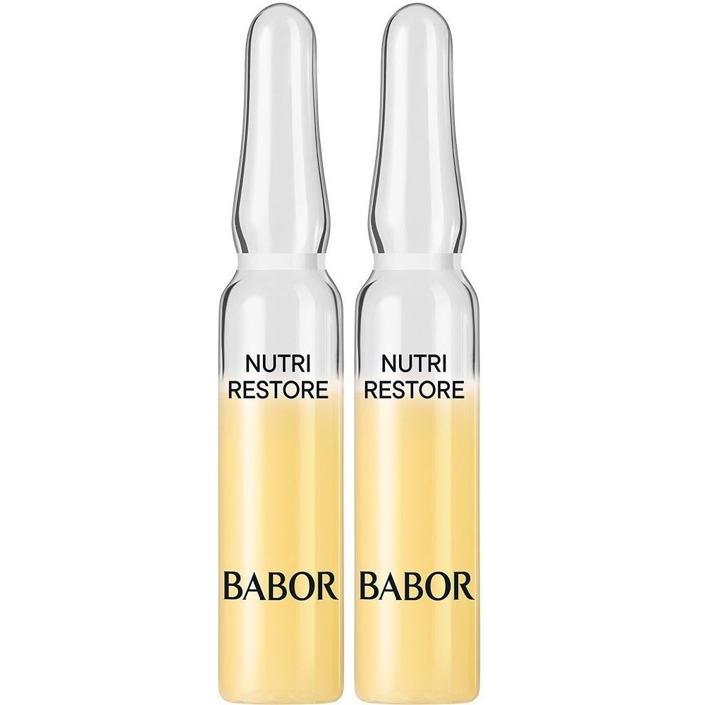 Zwei Babor Nutri Restore Ampullen mit gelblicher Flüssigkeit.