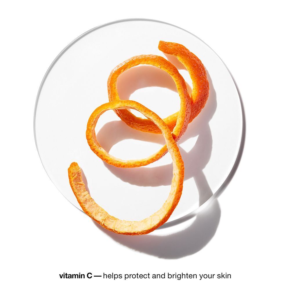 Transparente Schale mit Orangenschale. Text: vitamin C – helps protect and brighten your skin.