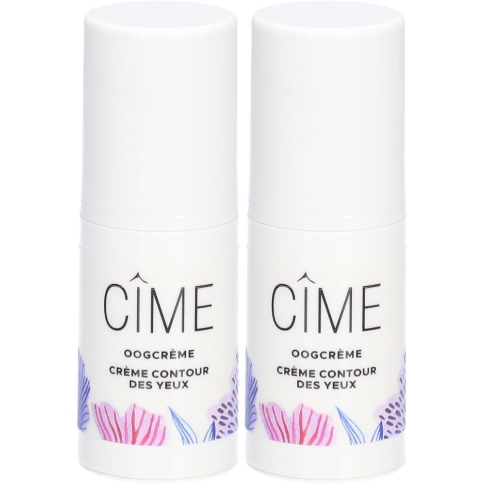 Twee witte cilindervormige flacons met doppen. Opschrift: Cîme, Oogcrème, Crème Contour des Yeux. Bloemenmotief.