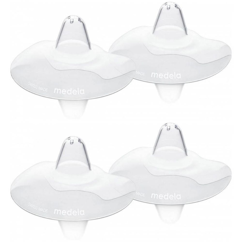 Quatre coussinets d'allaitement Medela en silicone, emballés individuellement.