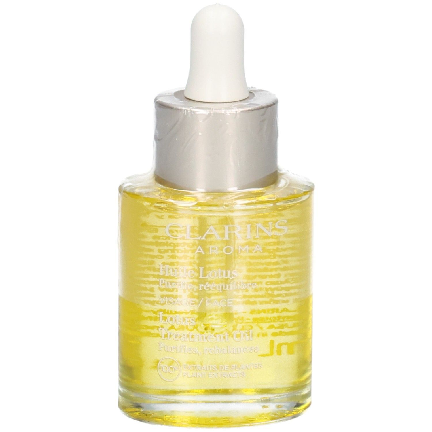 Clarins Aroma Huile Lotus Gesichtsöl in Glasflasche mit Pipette. Gelbe Flüssigkeit.