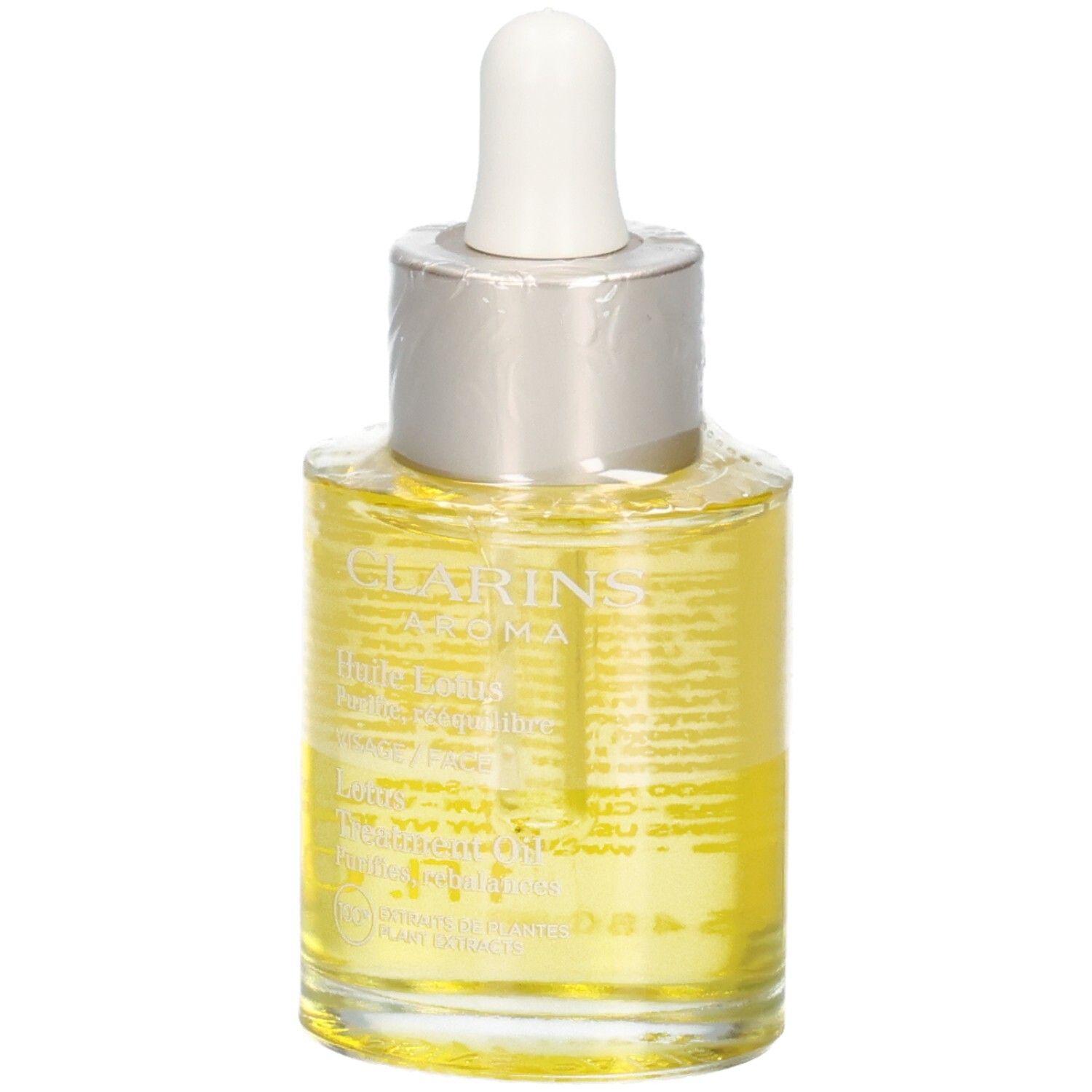 Clarins Aroma Huile Lotus Gesichtsöl. Gelbe Flüssigkeit in Glasflasche mit Pipette, mit Text.