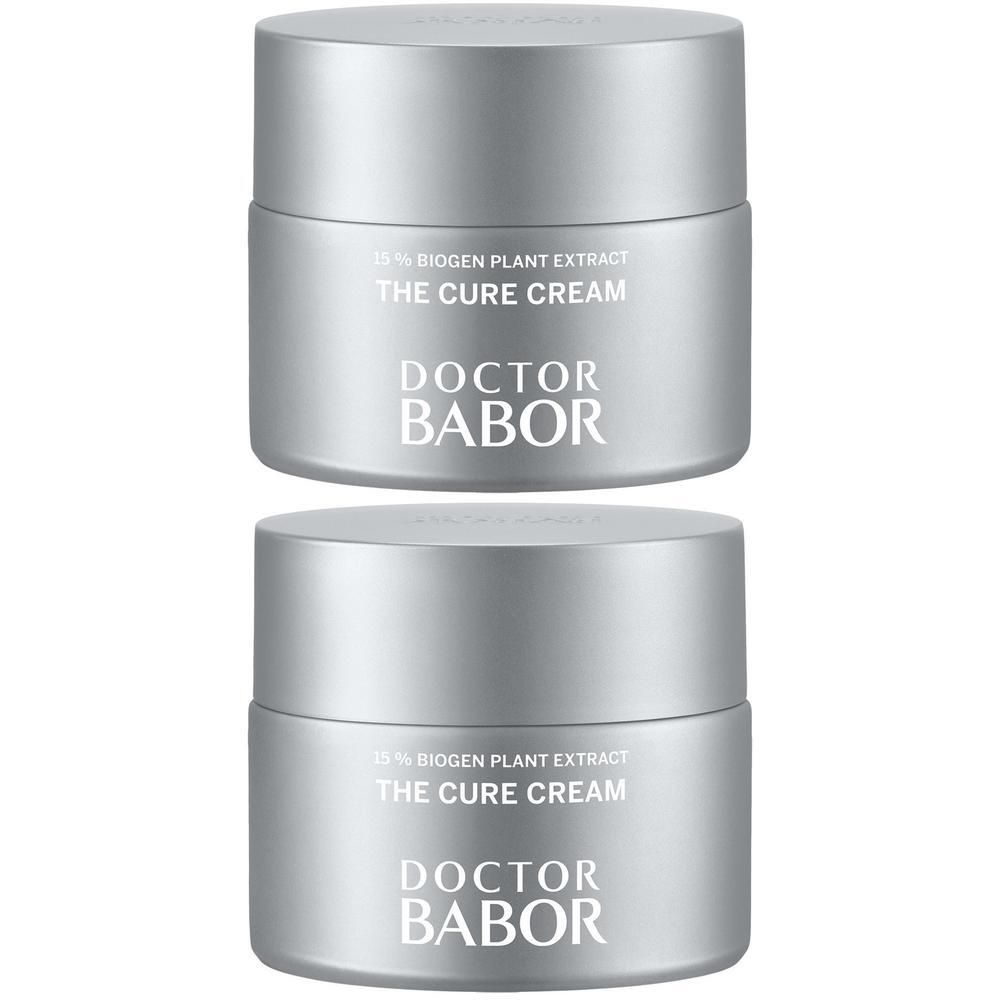 Zwei silberfarbene Tiegel mit Aufschrift THE CURE CREAM und DOCTOR BABOR.