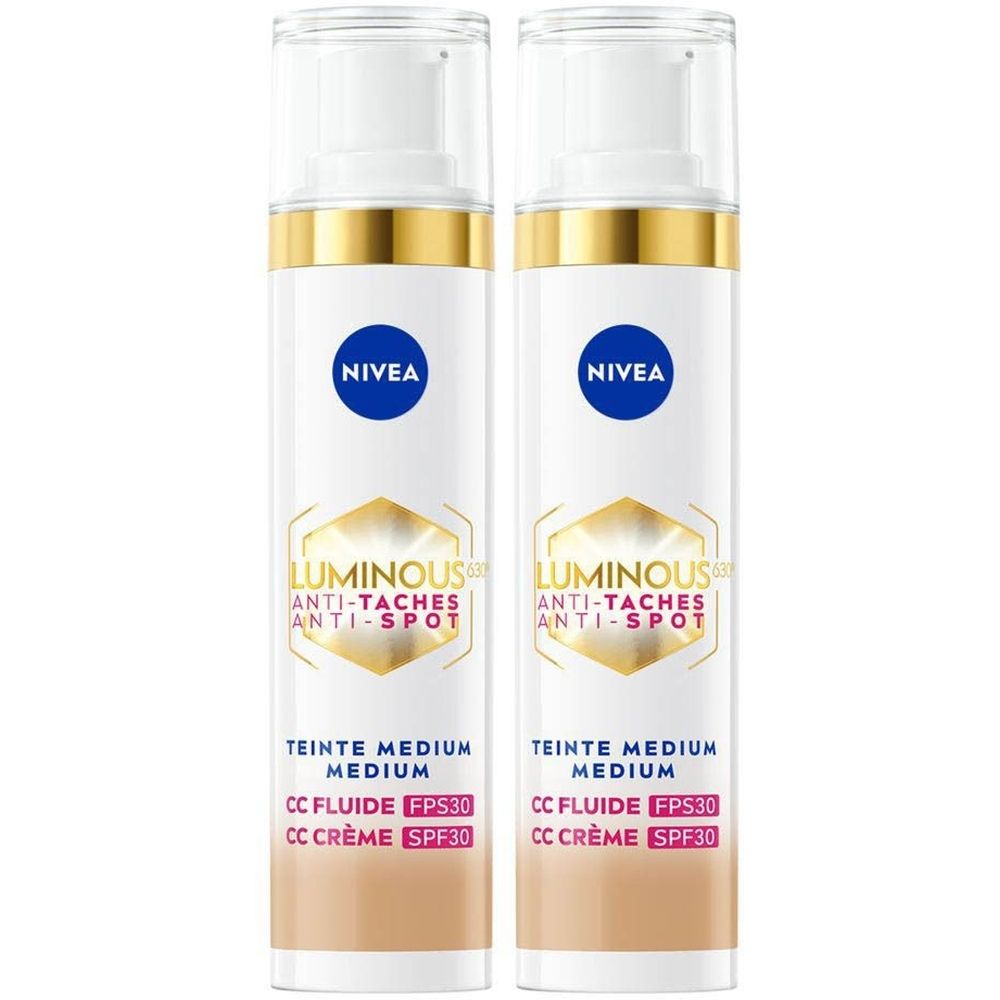 Twee flessen Nivea Cellular Luminous 630 CC Fluid Cream SPF30 Medium. Witte flessen met gouden accenten en blauwe logo's.