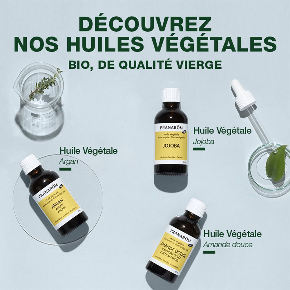 Plusieurs flacons d'huiles végétales. Texte: Huile Végétale Argan, Jojoba, Amande douce. Marque Pranarôm.