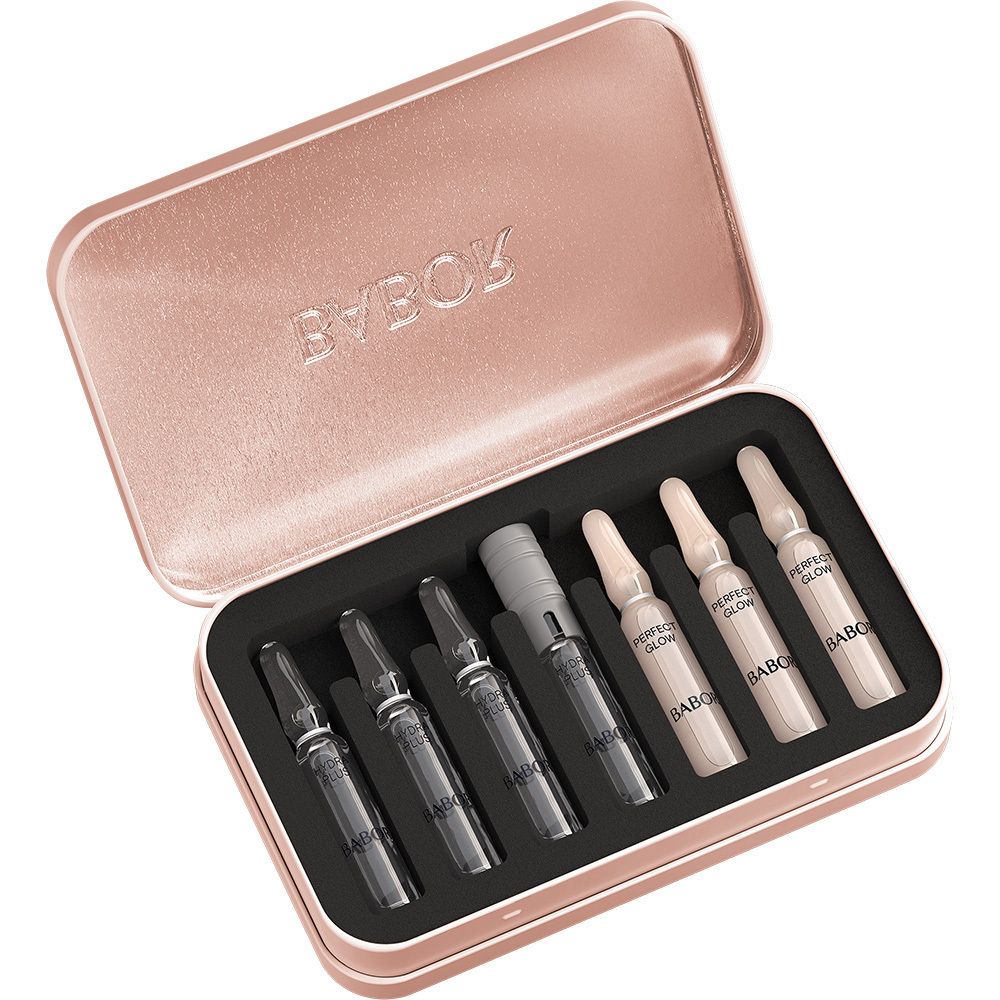 Babor Hydra Glow Ampullen in einer offenen, roségoldfarbenen Metalldose, mit 6 Ampullen und einem Applikator.