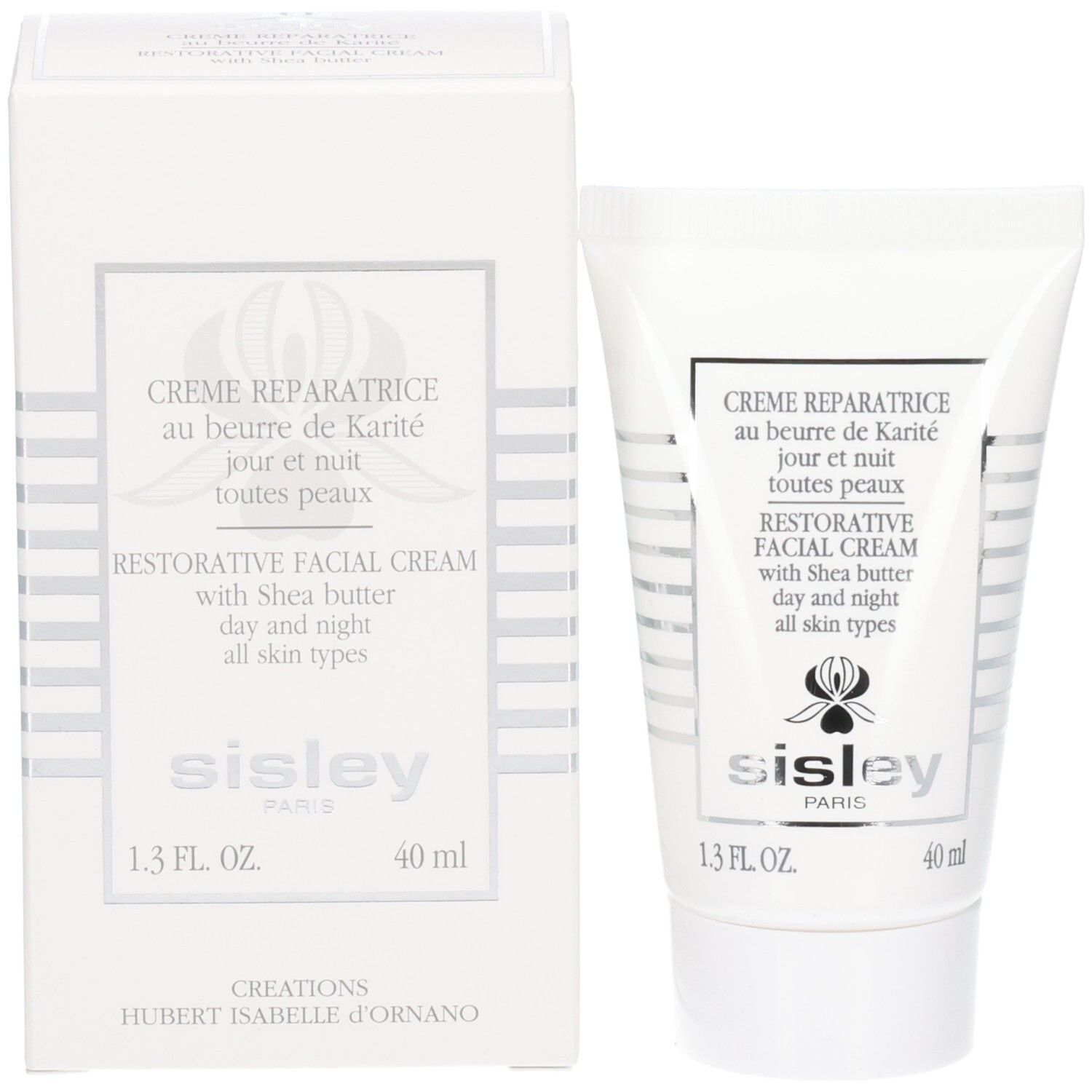 Sisley Creme Reparatrice Gesichtscreme neben der Umverpackung. Beides weiß mit silbernen Akzenten.