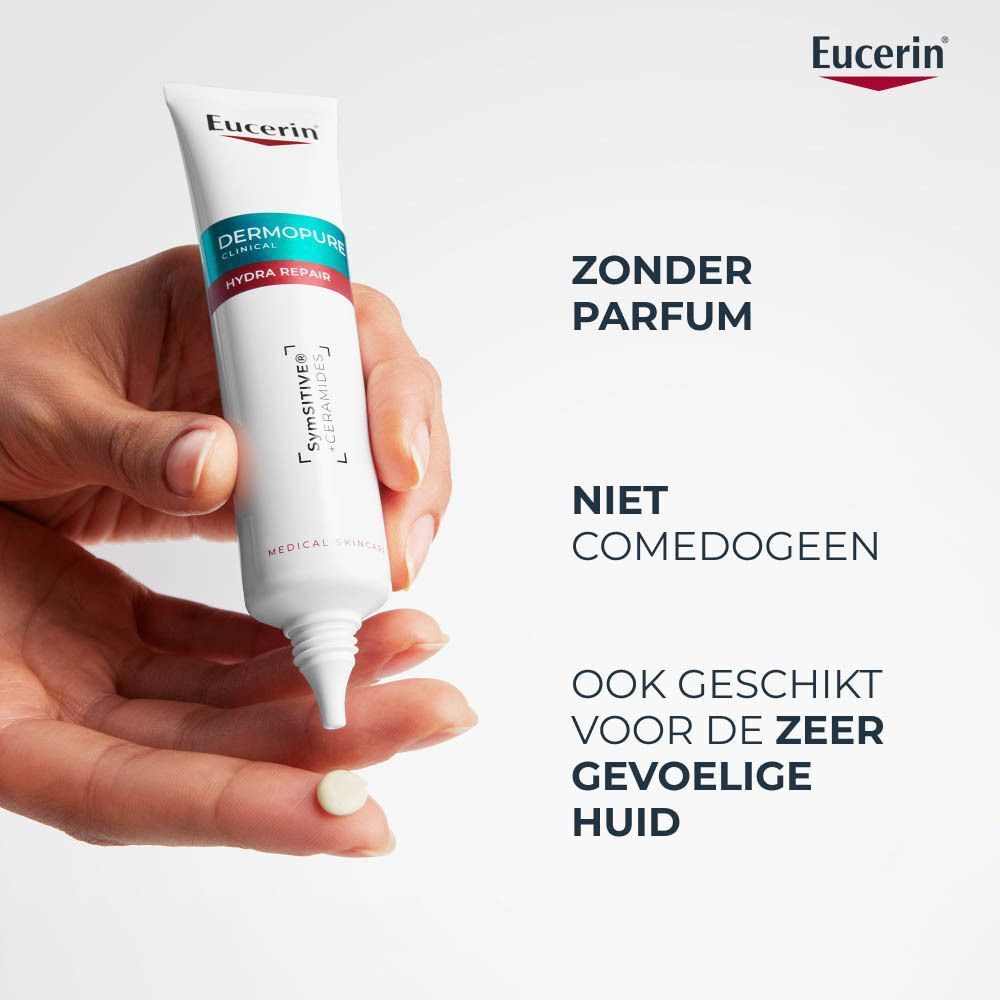 Tekst: Met verzachtend SymSITIVE™. Reguleert de gevoeligheid van de huid. Verzacht jeukerig en branderig gevoel.
